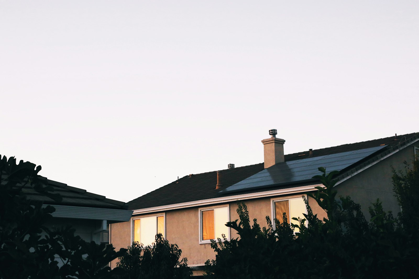 A family home with rooftop solar at dusk